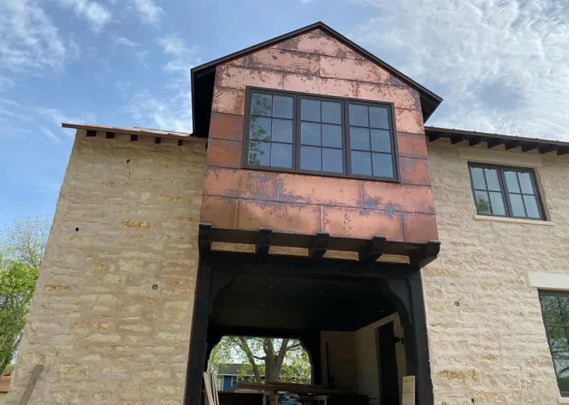 Copper metal panel facade on a stone building for Skylight Installation in East Norriton